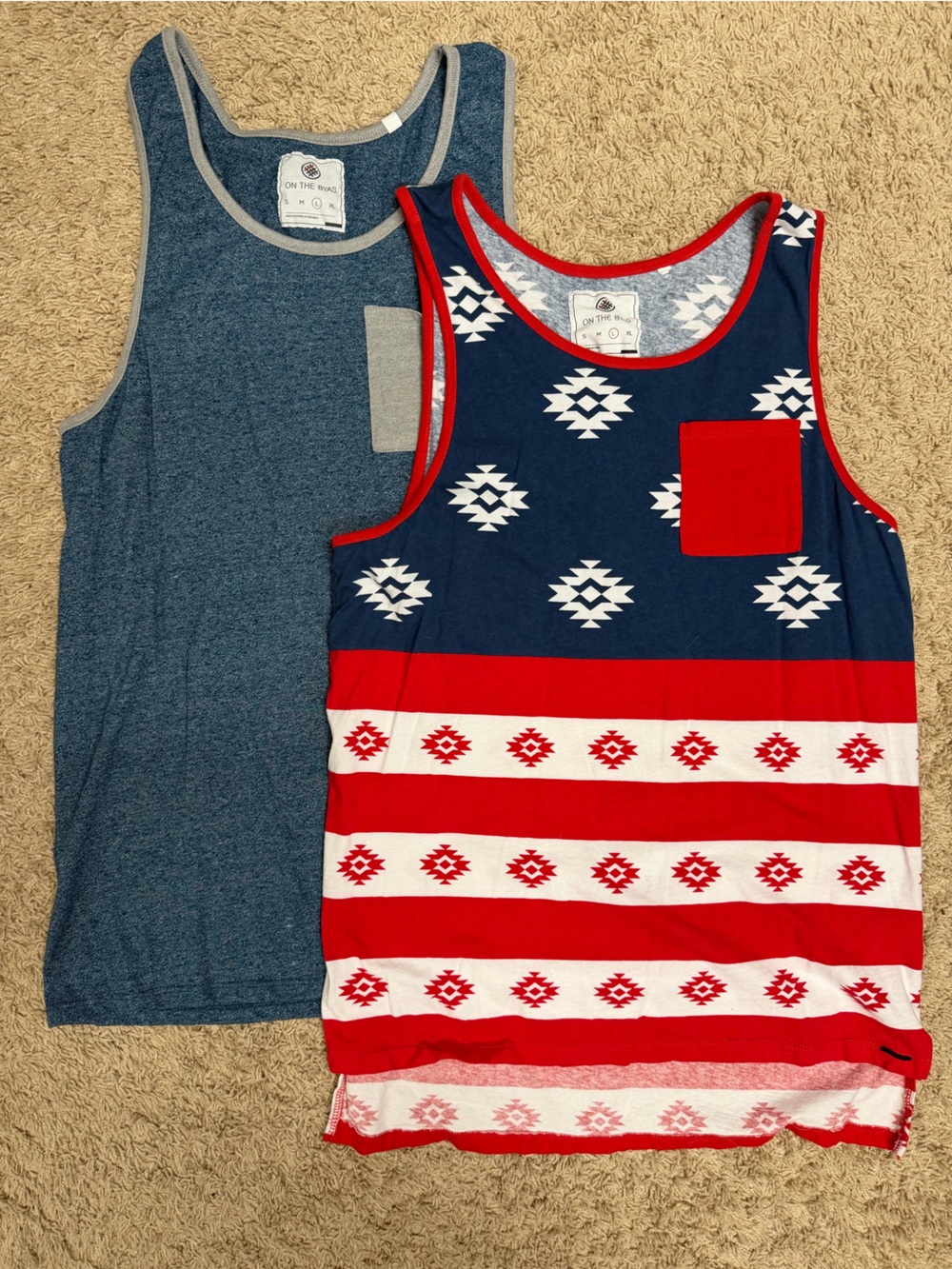 On the Byas blue tank and red, white, and blue pocket tanks
